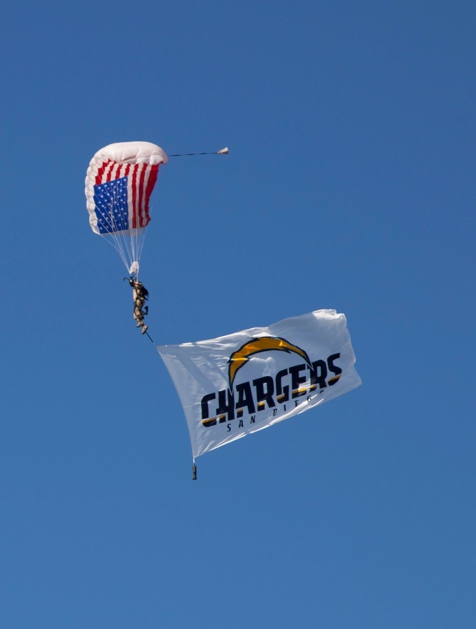 Image of Skydivers flying large corporate flags